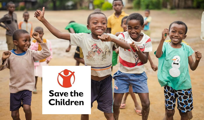 Save the Children — happy children playing and laughing together outdoors
